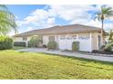 Spacious yard and manicured landscaping complement this single-Gathering home's exterior at 6994 Country Lakes Cir, Sarasota, FL 34243