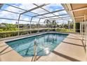 Enjoy this screened-in pool with views of the lake and lush landscaping at 6994 Country Lakes Cir, Sarasota, FL 34243