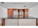 Kitchen with island and stainless steel appliances including refrigerator and microwave at 1120 E Kennedy Blvd # 615, Tampa, FL 33602