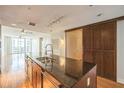 Modern kitchen island with stainless steel appliances, hardwood floors and sliding door at 1120 E Kennedy Blvd # 615, Tampa, FL 33602