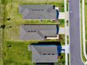 Overhead perspective of the homes, highlighting the neatly arranged landscaping and modern roofing at 11268 Fieldstone Dr, Palmetto, FL 34221