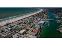 Coastal community aerial view, showing beach access, boat docks, and residential area at 1700 Pass A Grille Way # 9, St Pete Beach, FL 33706
