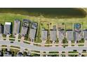 Aerial view of the property and surrounding neighborhood, with a pond in the back at 19796 Long Lake Ranch Blvd, Lutz, FL 33558