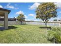 Spacious backyard with well-kept lawn and fenced perimeter at 19796 Long Lake Ranch Blvd, Lutz, FL 33558