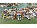 Waterfront home with a pool, and dock in a coastal neighborhood at 213 Harrison Ave, Belleair Beach, FL 33786