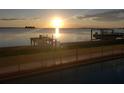 Lovely waterfront view with boat lift at sunrise at 2172 Harbor View Dr, Dunedin, FL 34698