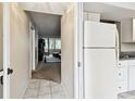 Welcoming hallway flows seamlessly into the living area, adjacent to the kitchen at 2614 Cove Cay Dr # 207, Clearwater, FL 33760