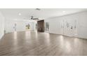 Spacious living room featuring new floors, fresh paint, a decorative fireplace, and modern lighting at 429 88Th Ave, St Pete Beach, FL 33706