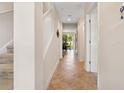 Inviting hallway with tile flooring leading to a bright, open living space at 456 Bahia Beach Blvd, Ruskin, FL 33570
