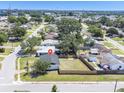 An aerial view of a neighborhood showcasing a home with a fenced-in yard at 5290 101St Ave, Pinellas Park, FL 33782