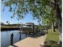 A boat sits on a boat lift on the canal side at 6533 Channelside Dr, New Port Richey, FL 34652