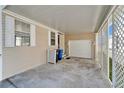 Attached carport providing convenient covered parking and easy access to the home's entrance at 8528 Fantasia Park Way, Riverview, FL 33578