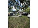 Beautiful home with a well-manicured lawn, decorative rock garden, and a circular driveway at 2917 W Fern St, Tampa, FL 33612