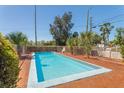 Inviting private swimming pool with brick patio offers a refreshing outdoor retreat at 101 Pampas Ave, Tarpon Springs, FL 34689