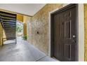 Unit entrance with outdoor hallway and stairs at 10103 Courtney Oaks Cir # 103, Tampa, FL 33619