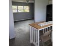 Open living room area with neutral walls, ceiling fan, and lots of natural light at 10106 66Th Ave, Seminole, FL 33772