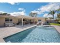 Gorgeous swimming pool, with outdoor seating, perfect for entertaining guests in the backyard at 1137 86Th N Ave, St Petersburg, FL 33702