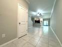 Inviting living room featuring neutral paint and tile flooring throughout at 11823 Dumaine Valley Rd, Riverview, FL 33579