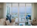 Bright living room showcasing balcony access and water views at 1325 Snell Isle Ne Blvd # 607, St Petersburg, FL 33704