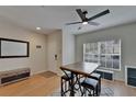 Bright entryway with a dining table, stylish fan, and a window for natural light at 15825 Fishhawk View Dr, Lithia, FL 33547