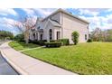 Well maintained townhome showcasing lawn and side entrance at 15939 Fishhawk View Dr, Lithia, FL 33547