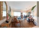 Inviting living room with wood floors, comfortable seating, and natural light at 1616 Laughton Pl, Sun City Center, FL 33573