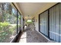 Spacious screened-in patio with tiled flooring, providing a relaxing outdoor living space at 1616 Laughton Pl, Sun City Center, FL 33573