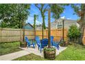 Cozy backyard seating area with string lights, perfect for outdoor relaxation at 2215 Thrace St, Tampa, FL 33605