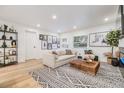 Open concept living room with light floors, stylish decor, and plenty of natural light at 401 N Manhattan Ave, Tampa, FL 33609