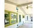Spacious screened-in patio featuring durable concrete flooring, a ceiling fan and beadboard ceiling at 4485 49Th N Ave, St Petersburg, FL 33714