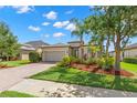 Charming home with lush landscaping, brick paver driveway, and neutral paint at 4826 68Th Street E Cir, Bradenton, FL 34203
