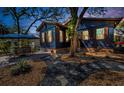 Well maintained backyard with rock and stone landscaping and patio seating area at 525 Lexington St, Dunedin, FL 34698