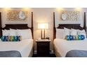 Comfortable bedroom featuring two beds, stylish decor, and a relaxing ambiance at 5500 Gulf Blvd # 4246, St Pete Beach, FL 33706