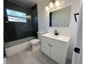 Modern bathroom featuring a glass-enclosed shower and sleek vanity with under sink storage at 6982 79Th N Ave, Pinellas Park, FL 33781
