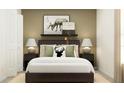 Cozy bedroom with a comfortable bed, stylish nightstands, decorative pillows, and elegant lamps at 8116 Painted Sky Pl, Land O Lakes, FL 34637