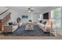 Open-concept living room featuring neutral walls and flooring, offering a versatile space at 9107 Gablewood Pl, Land O Lakes, FL 34638
