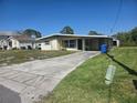 Inviting home with a long driveway, providing ample parking space and curb appeal at 125 18Th Nw St, Ruskin, FL 33570