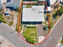 A high-angle shot highlights the home's unique layout, neighborhood street access, and cozy outdoor space at 13098 Boca Ciega Ave, Madeira Beach, FL 33708