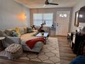 Cozy living room featuring a comfortable sectional sofa, stylish decor, and plenty of natural light at 3471 40Th N Way, St Petersburg, FL 33713