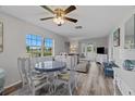Inviting living room with wood floors, golf course view, and comfortable seating at 3827 Trophy Blvd # 0, New Port Richey, FL 34655