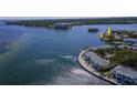 Expansive aerial perspective of waterfront condos and surrounding bay, showcasing its prime location at 5242 Beach Se Dr, St Petersburg, FL 33705