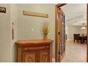 Hallway with decor and a view of the dining room, showing interior design at 5301 Gulf Blvd # B508, St Pete Beach, FL 33706
