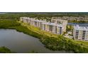 Exterior of the building in the Seminole Isle community, showcasing its proximity to the water and green spaces at 7040 Key Haven Rd # 601, Seminole, FL 33777