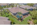 Aerial view of home featuring screened-in pool and well-maintained backyard at 20142 Lace Cascade Rd, Land O Lakes, FL 34637
