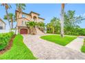 Beautiful home with tropical landscaping and a long driveway at 2149 Bayou Grande Ne Blvd, St Petersburg, FL 33703