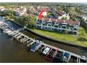 Aerial view showcasing a waterfront community with private boat docks and easy access to the open water at 2387 Hanover Dr # 2387, Dunedin, FL 34698