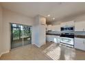 Updated kitchen with stainless steel appliances and granite countertops at 2837 Santego Bay Ct, Brandon, FL 33511