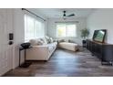 Bright living room featuring new flooring, neutral decor, and ample natural light at 4507 26Th S Ave, Tampa, FL 33619