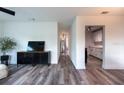 Bright and airy living room featuring modern wood flooring and neutral decor at 4507 26Th S Ave, Tampa, FL 33619