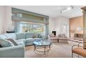 Bright living room featuring comfortable seating, a glass table, and ample natural light at 4973 60Th S Ave, St Petersburg, FL 33715